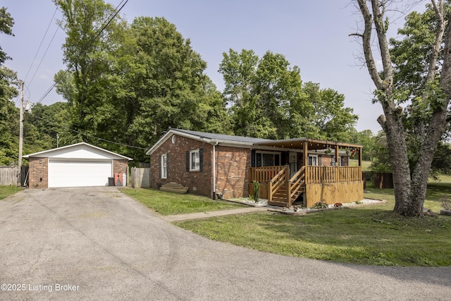 94 Buckhorn Ln, Leitchfield, KY 42754 - view of front of home featuring brick siding, a garage, and an outdoor structure