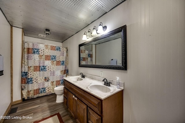 94 Buckhorn Ln, Leitchfield, KY 42754 - full bath featuring wood finished floors, double vanity, and curtained shower