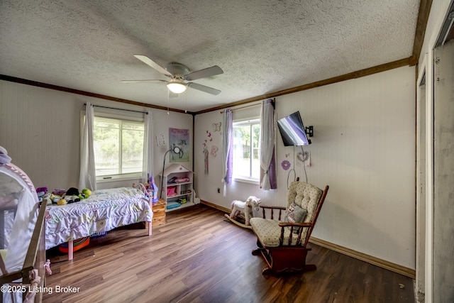 94 Buckhorn Ln, Leitchfield, KY 42754 - bedroom featuring crown molding, multiple windows, wood finished floors, a textured ceiling, and ceiling fan