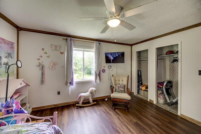 94 Buckhorn Ln, Leitchfield, KY 42754 - bedroom featuring crown molding, dark wood-type flooring, a textured ceiling, multiple closets, and a ceiling fan