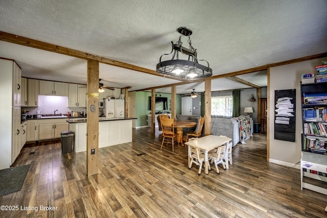 94 Buckhorn Ln, Leitchfield, KY 42754 - dining space with ceiling fan, dark wood-style floors, a textured ceiling, and beam ceiling