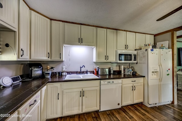 94 Buckhorn Ln, Leitchfield, KY 42754 - kitchen featuring white appliances, dark countertops, a textured ceiling, and dark wood-style floors