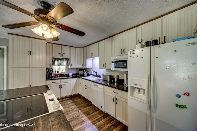 94 Buckhorn Ln, Leitchfield, KY 42754 - kitchen featuring white appliances, dark countertops, a textured ceiling, dark wood-style flooring, and ceiling fan
