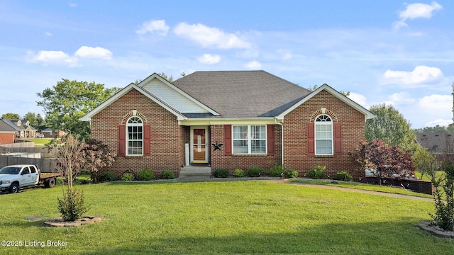 131 Benelli Dr, Bardstown, KY 40004 - view of front of house featuring a front yard, brick siding, and roof with shingles