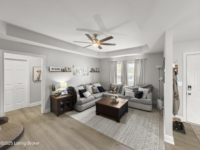 131 Benelli Dr, Bardstown, KY 40004 - living area featuring light wood finished floors, a raised ceiling, and ceiling fan