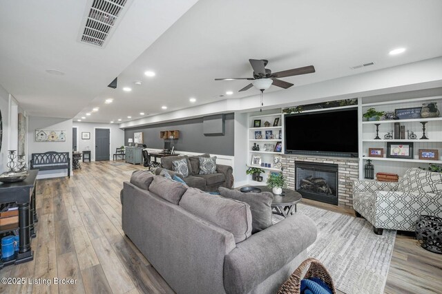 57 Pilots Way, Taylorsville, KY 40071 - living room with wood finished floors, ceiling fan, recessed lighting, a fireplace, and built in shelves