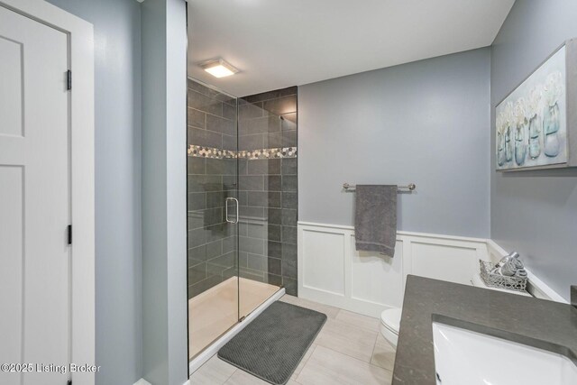 57 Pilots Way, Taylorsville, KY 40071 - bathroom with a shower stall, vanity, tile patterned flooring, wainscoting, and a decorative wall