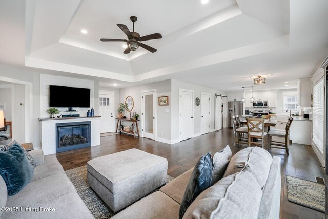 57 Pilots Way, Taylorsville, KY 40071 - living area with a tray ceiling, a ceiling fan, dark wood-style flooring, and recessed lighting
