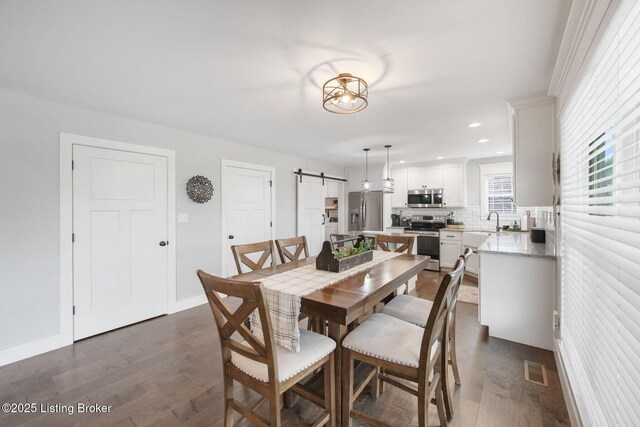 57 Pilots Way, Taylorsville, KY 40071 - dining room featuring a barn door, dark wood-style flooring, and recessed lighting