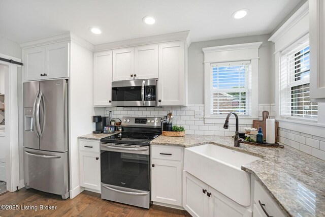 57 Pilots Way, Taylorsville, KY 40071 - kitchen with appliances with stainless steel finishes, white cabinetry, dark wood finished floors, decorative backsplash, and recessed lighting