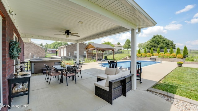 57 Pilots Way, Taylorsville, KY 40071 - fenced backyard with a gazebo, a ceiling fan, a patio, outdoor dining area, and an outdoor hangout area