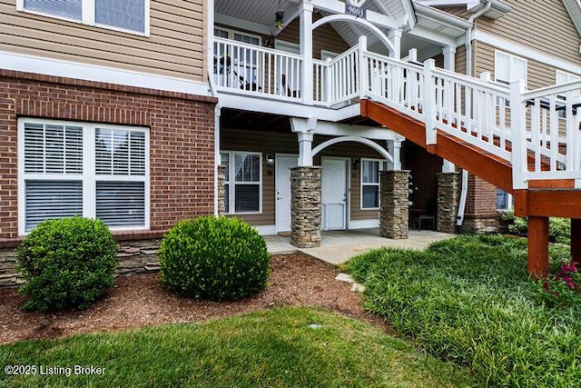 9003 Falcon Crest Ct Unit 104, Louisville, KY 40219 - doorway to property featuring brick siding