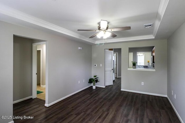 9003 Falcon Crest Ct Unit 104, Louisville, KY 40219 - spare room featuring a raised ceiling, dark wood-style flooring, a ceiling fan, and crown molding