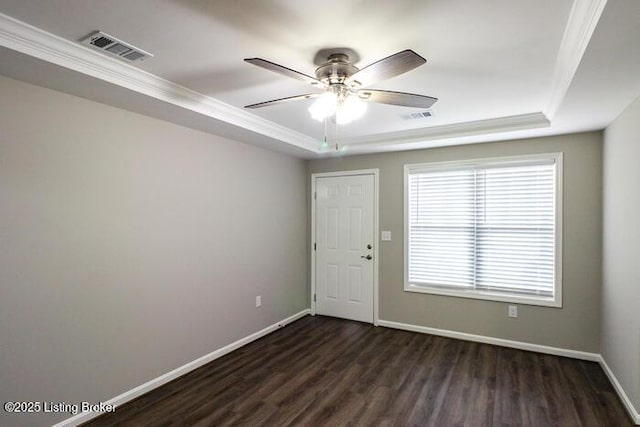 9003 Falcon Crest Ct Unit 104, Louisville, KY 40219 - unfurnished room featuring a raised ceiling, crown molding, dark wood-style floors, and ceiling fan