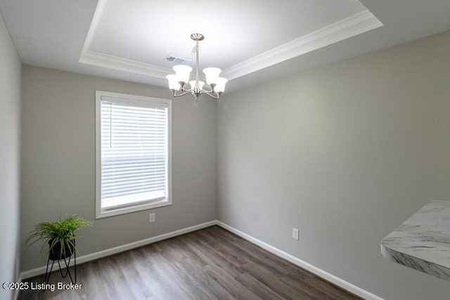 9003 Falcon Crest Ct Unit 104, Louisville, KY 40219 - spare room featuring a tray ceiling, ornamental molding, a chandelier, wood finished floors, and plenty of natural light