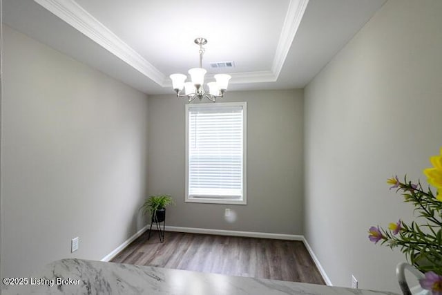 9003 Falcon Crest Ct Unit 104, Louisville, KY 40219 - unfurnished room with ornamental molding, wood finished floors, a raised ceiling, and a chandelier