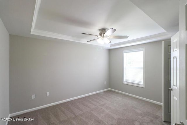 9003 Falcon Crest Ct Unit 104, Louisville, KY 40219 - carpeted empty room featuring a raised ceiling, ceiling fan, and ornamental molding