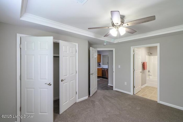 9003 Falcon Crest Ct Unit 104, Louisville, KY 40219 - unfurnished bedroom with crown molding, carpet, a raised ceiling, connected bathroom, and a closet