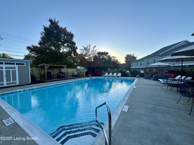 9003 Falcon Crest Ct Unit 104, Louisville, KY 40219 - community pool featuring a pergola, a patio, outdoor lounge area, and a storage shed