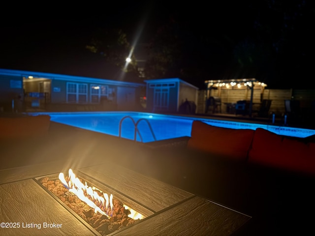 9003 Falcon Crest Ct Unit 104, Louisville, KY 40219 - pool at twilight with an outdoor fire pit