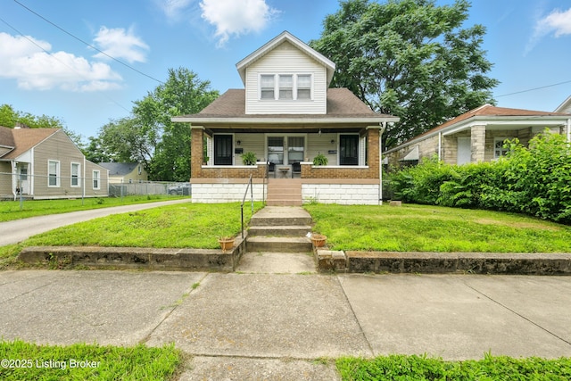 2618 S 5th St, Louisville, KY 40208 - bungalow-style home with brick siding and covered porch