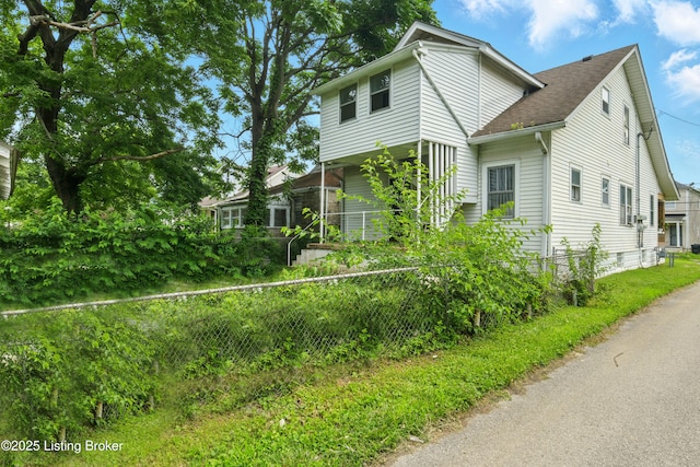 2618 S 5th St, Louisville, KY 40208 - view of property exterior featuring roof with shingles