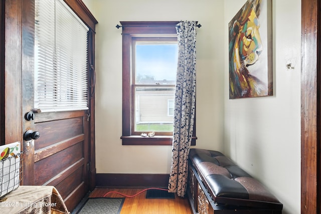2618 S 5th St, Louisville, KY 40208 - doorway to outside featuring wood finished floors and baseboards