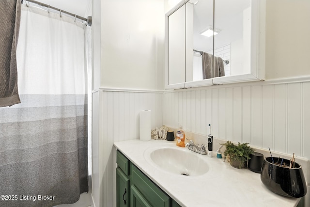 2618 S 5th St, Louisville, KY 40208 - bathroom featuring wainscoting, vanity, and a shower with curtain
