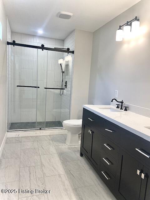 1711 Washington Blvd, Lyndon, KY 40242 - bathroom with a shower stall, double vanity, and marble look tiles