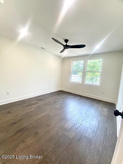1711 Washington Blvd, Lyndon, KY 40242 - spare room with ceiling fan and dark wood-style flooring