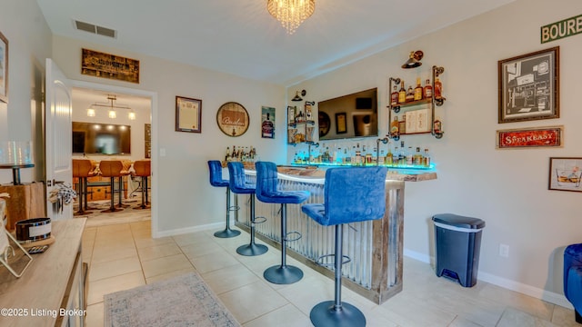 116 N Howard St, Bardstown, KY 40004 - indoor wet bar with tile patterned floors and baseboards