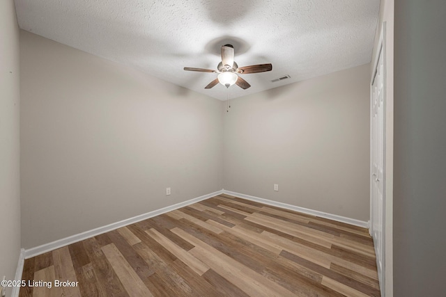 606 Lone Oak Rd, Clarkson, KY 42726 - empty room with a ceiling fan, wood finished floors, and a textured ceiling