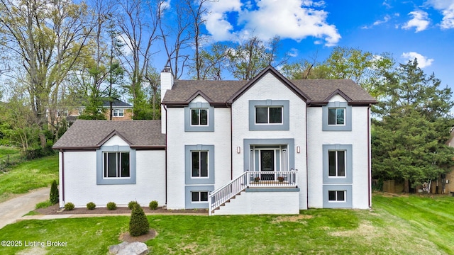 5515 Hempstead Rd, Louisville, KY 40207 - view of front of house with brick siding, a chimney, and a front yard