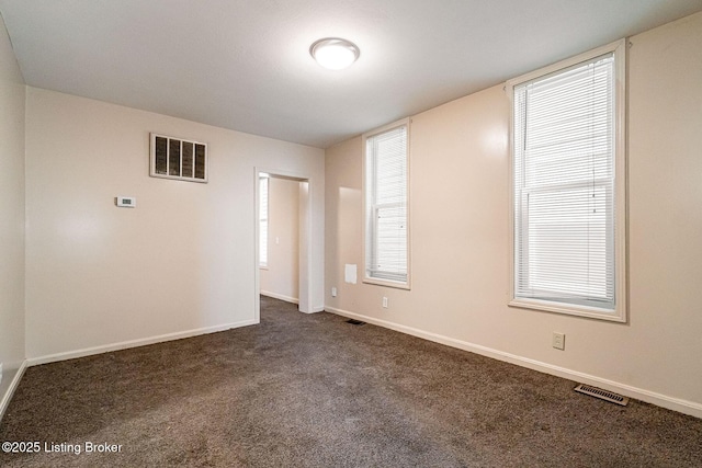 2113 Willow St, New Albany, IN 47150 - unfurnished room featuring dark carpet and baseboards