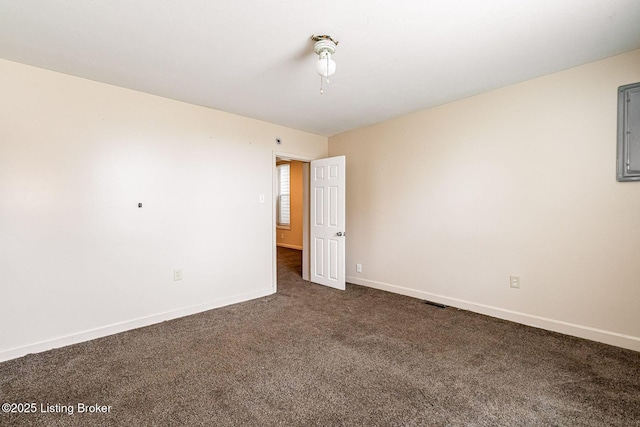 2113 Willow St, New Albany, IN 47150 - unfurnished room with dark colored carpet and baseboards