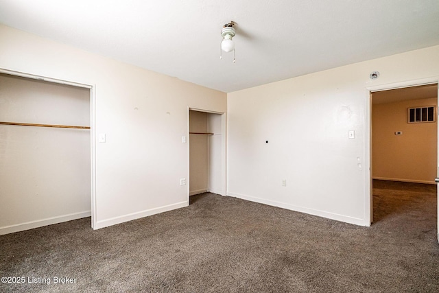 2113 Willow St, New Albany, IN 47150 - unfurnished bedroom with carpet, two closets, and ceiling fan