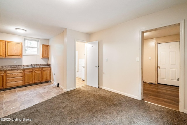 2113 Willow St, New Albany, IN 47150 - kitchen with light carpet and brown cabinets