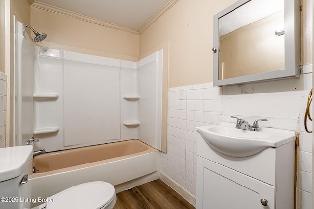 2113 Willow St, New Albany, IN 47150 - bathroom with ornamental molding, wood finished floors, vanity, tile walls, and shower / bath combination