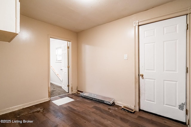 2113 Willow St, New Albany, IN 47150 - unfurnished room featuring dark wood-type flooring and baseboards