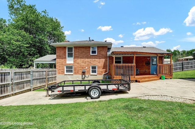 3408 Acacia Ave, Shepherdsville, KY 40165 - rear view of house with a patio, a fenced backyard, a wooden deck, and brick siding