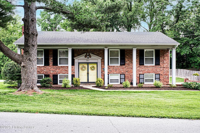 7401 Switch Bark Rd, Louisville, KY 40228 - split foyer home with brick siding, covered porch, and roof with shingles