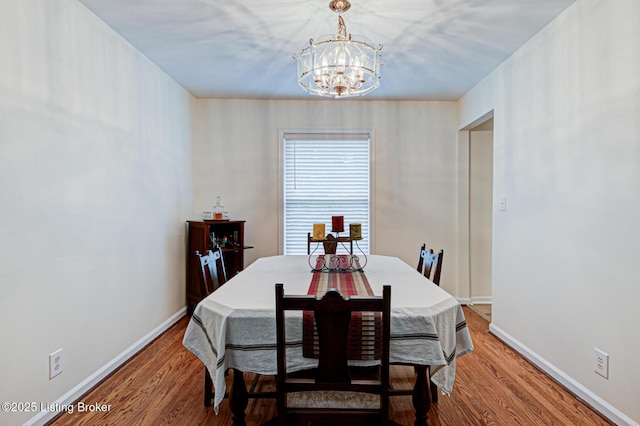 7401 Switch Bark Rd, Louisville, KY 40228 - dining room with a chandelier and wood finished floors