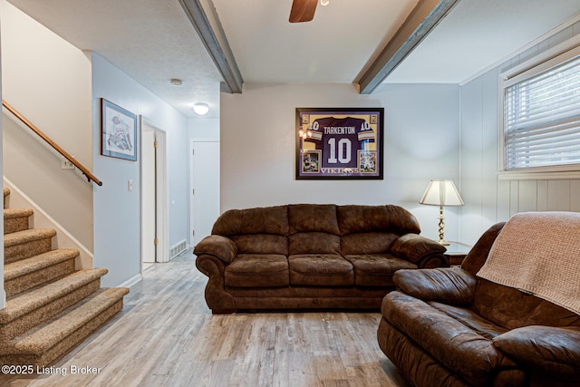 7401 Switch Bark Rd, Louisville, KY 40228 - living area with wood finished floors, beamed ceiling, stairs, and ceiling fan