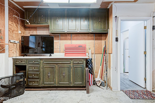 7401 Switch Bark Rd, Louisville, KY 40228 - kitchen with green cabinets, light countertops, and concrete flooring