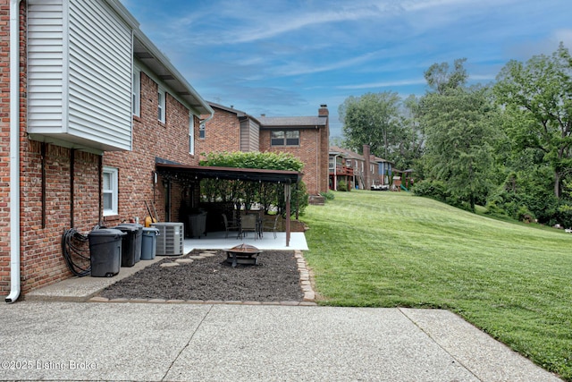 7401 Switch Bark Rd, Louisville, KY 40228 - view of grassy yard featuring a patio area and an outdoor fire pit