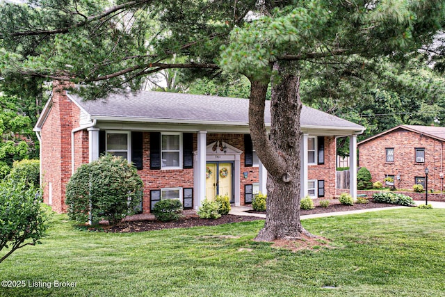 7401 Switch Bark Rd, Louisville, KY 40228 - bi-level home with brick siding, a front lawn, and a chimney