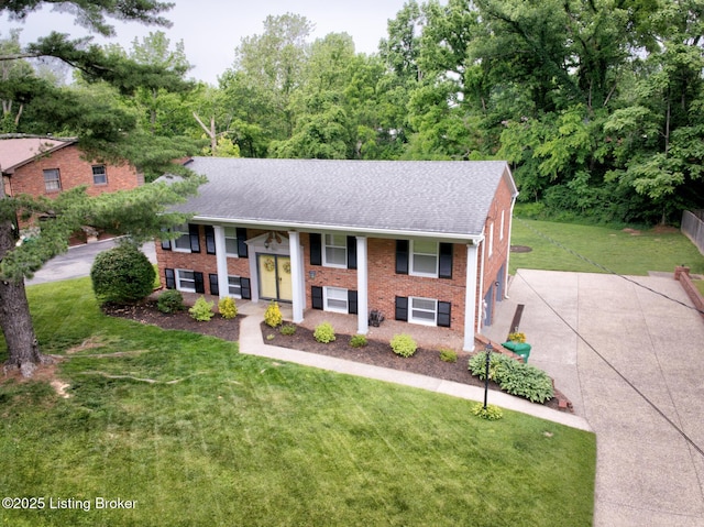 7401 Switch Bark Rd, Louisville, KY 40228 - raised ranch with a front lawn, brick siding, a porch, and a shingled roof