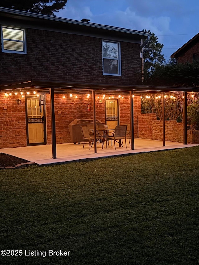 7401 Switch Bark Rd, Louisville, KY 40228 - back of house with a patio area, brick siding, and a lawn