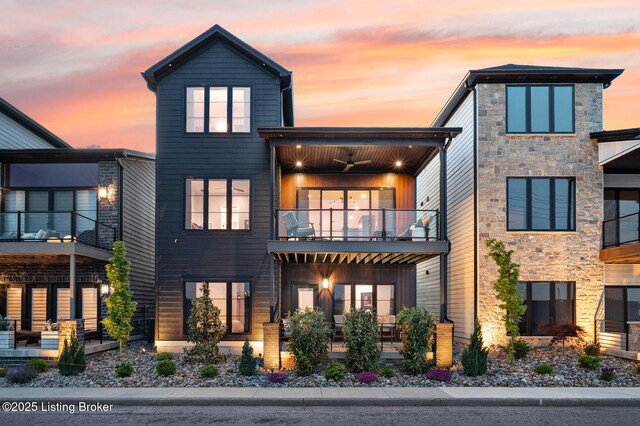 104 Howard Ln, Jeffersonville, IN 47130 - contemporary house featuring a balcony, stone siding, and ceiling fan