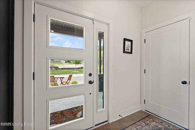 104 Howard Ln, Jeffersonville, IN 47130 - foyer entrance with baseboards and wood finished floors